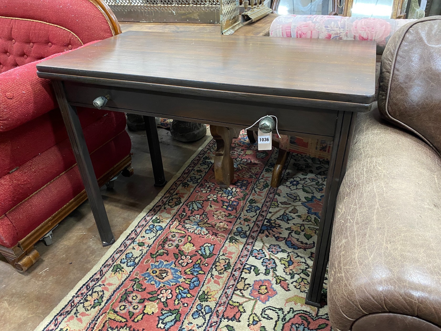 A Continental mahogany folding and extending dining table, with three extra leaves, width 97cm